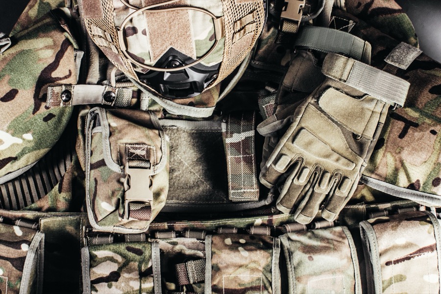 MultiCam plate carrier laid out flat with helmet, gloves and pouches before setup