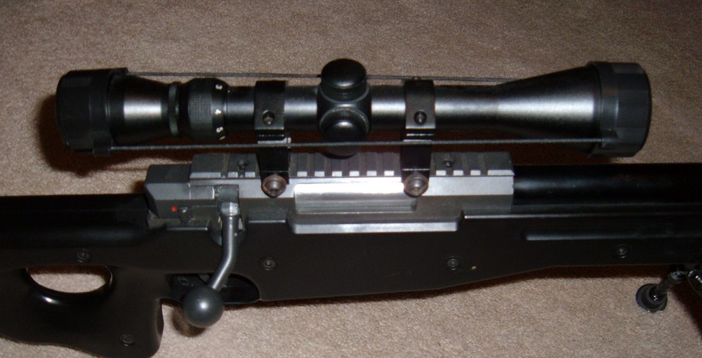 Scope and bolt handle on an airsoft bolt-action sniper rifle
