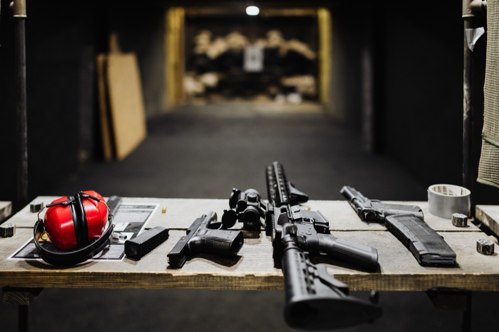 Shooting bay gear laid out with the range lanes behind