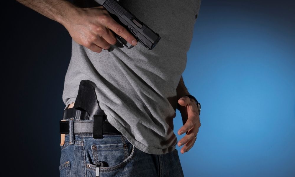 Close-up of a concealed draw from an IWB belt holster