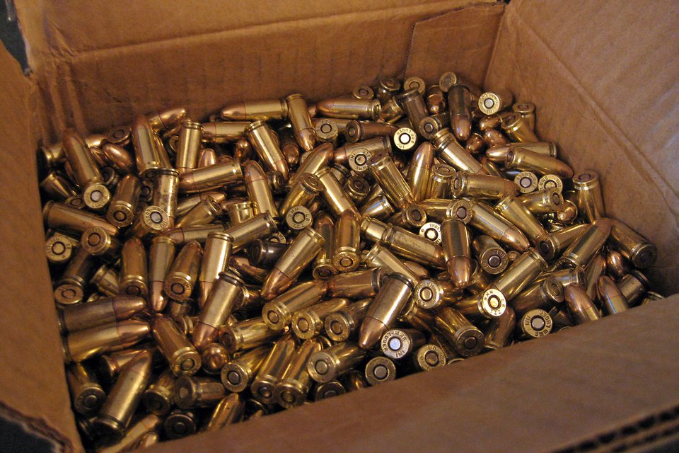An open carton of loose 9mm pistol ammunition β round count is the biggest line in the per-match budget