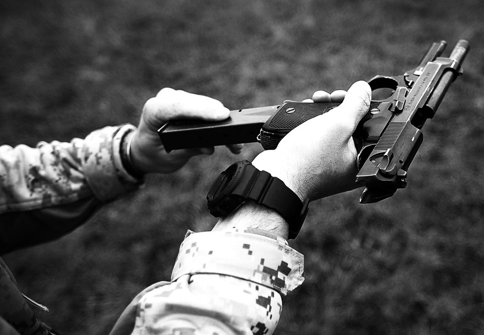 Inserting a fresh magazine into the magwell